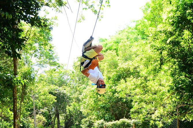 3 adrenaline activities Atvs Zipline and a swim experience in a cenote - Ziplining above the jungle