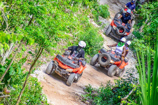 Action-packed Cancun ATV tour, Ziplines, Cenote, Lunch and More - Swimming in a natural cenote