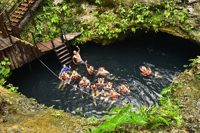 ATV, Ziplines, Tarzan Jump, Lunch and Transportation Day Tour - The cenote, ladder, and Tarzan swing