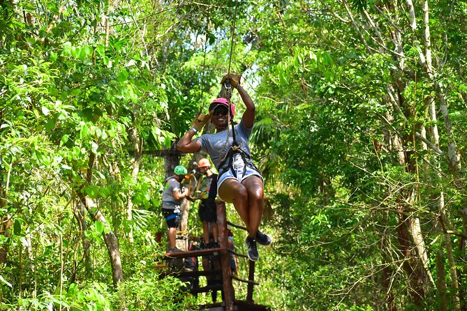 Awesome ATV experience in the jungle with cenote swim and ziplines included - Ziplining above the trees