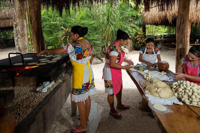 Cenote Tankah and Mayan Village Tour with Zipline, Canoes & Lunch - Canoeing across clear water