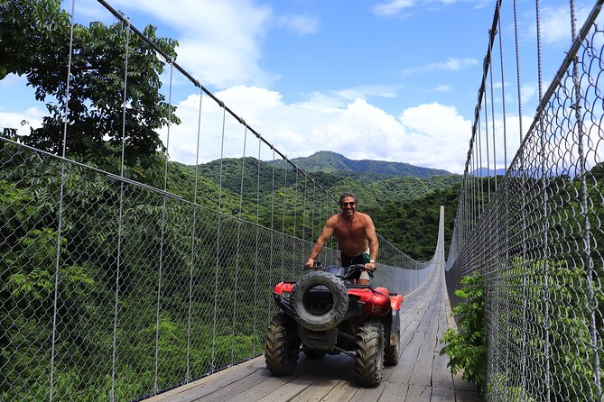 Combo ATV Jorullo Bridge + zip lines + mule ride - Starting at Canopy River’s Playa de Oro Office