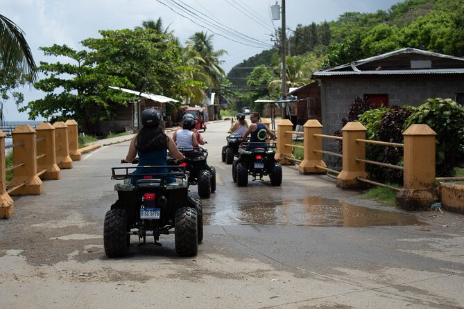 Day Tour in Roatan: ATV, Sloths, Monkeys and Zipline - ATV riding on roads, forest paths, and muddy ground
