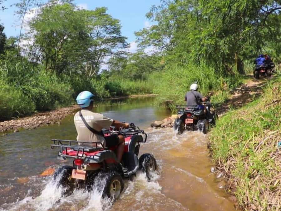 KhaoLak:ATV, ZipLine, & Rafting Adventure Monkey Cave Temple - A 30-minute ATV ride through mud and greenery