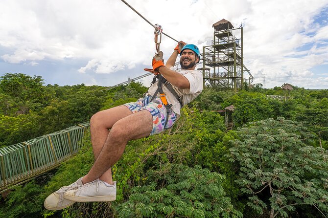 Sky Trail: Sky Bike, Tarzania, Bungee Swing & Zip Line with lunch - Climbing 16 meters to the first platform