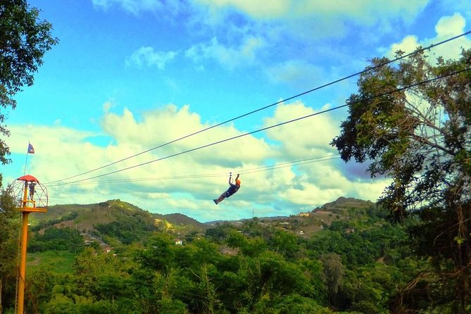 Zipline Canopy Tour with Transport from San Juan - Getting suited up beneath El Yunque