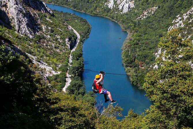 A rider crossing the Cetina canyon in Croatia on a zipline